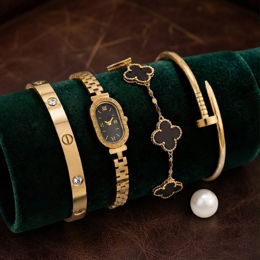 Gold clover-inspired bracelet with matching watch and bangle displayed together
