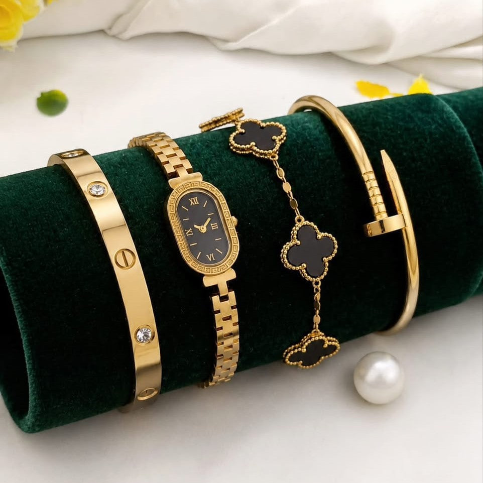 Close-up of the gold clover jewelry set showing detailed craftsmanship